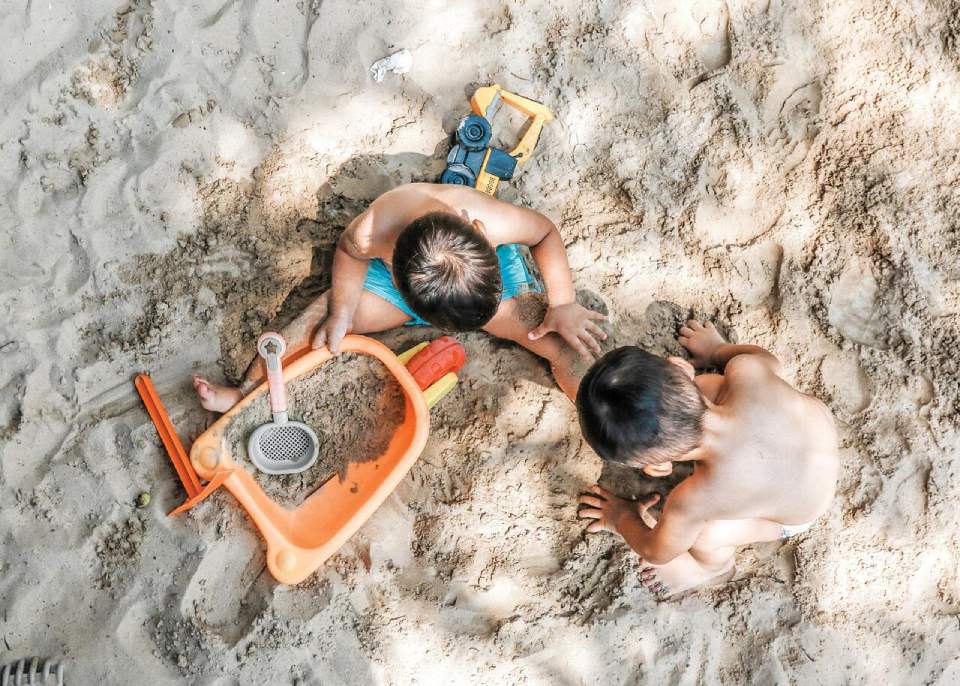 beach kids playing in the sand