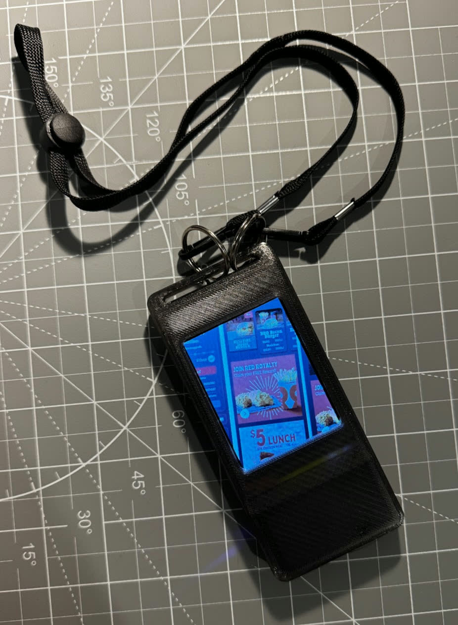 Badge on a lanyard displaying a Red Rooster portfolio screen